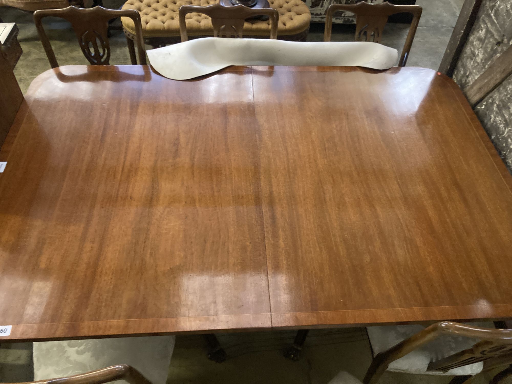 A Regency style mahogany two pillar extending dining table, length 240cm extended (two spare leaves), width 98cm, height 75cm